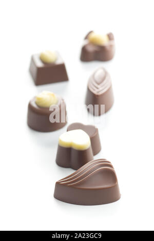Various chocolate pralines isolated on white background. Stock Photo