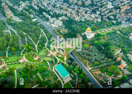 Aerial view of the colorful, magnificent Bahai garden on the hills of the Carmel in Haifa Israel, with orange and green geometric shapes Stock Photo