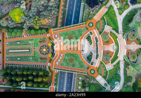 Aerial view of the colorful, magnificent Bahai garden on the hills of the Carmel in Haifa Israel, with orange and green geometric shapes Stock Photo