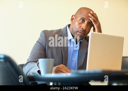 African American man having a difficult time at work. Stock Photo