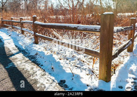Freshly Fallen Snow on a Wood Fence Stock Photo