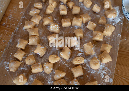 chef at work. making of paleo pumpkin gnocchi. woman hands preparing the food. Stock Photo
