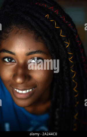 Interior close up portrait of young black woman with dreadlocks, Cali, Colombia Stock Photo