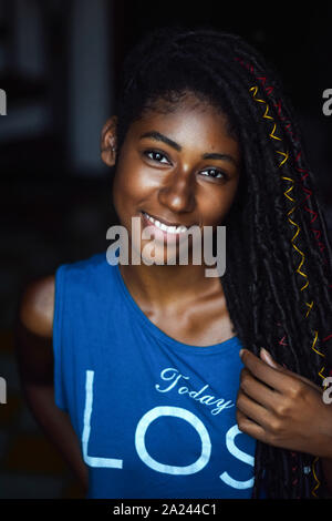 Interior close up portrait of young black woman with dreadlocks, Cali, Colombia