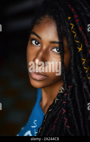 Interior close up portrait of young black woman with dreadlocks, Cali, Colombia Stock Photo