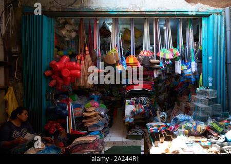 A store selling kitchen, cleaning supplies at the old, local, traditional market, Pasar Pabean. In the Arab Quarter section of Surabaya, Indonesia. Stock Photo