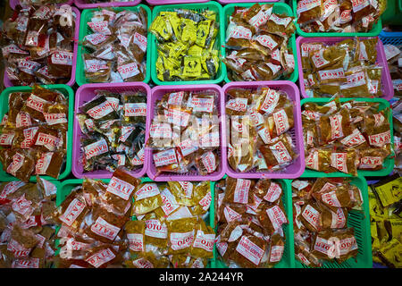 A wide variety and selection of pre-packaged spices and seasonings for sale at the old, local, traditional market, Pasar Pabean. In the Arab Quarter s Stock Photo