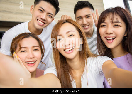 Close up of five excited friend taking selfie photo Stock Photo