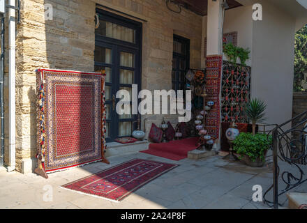 Sale of old carpet and souvenirs in eastern city Stock Photo