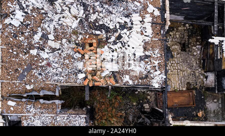 remnants of a house after a fire aerial photography from a drone Stock Photo