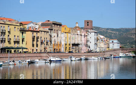 panoramic view of the ancient buildings of the city of Bosa along the 'Temo' river on a sunny summer day Stock Photo