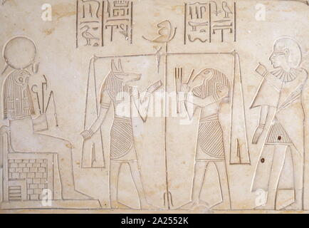 Alabaster plaque depicting the weighing of souls by Anubis the Ancient Egyptian God of the afterlife. Stock Photo