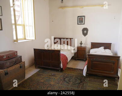 bedroom used by Howard Carter, at his home, whilst he stayed in the West bank near Luxor, during his digs in Egypt. Howard Carter House is noticeable by its domed roof and lush green gardens surrounding the property The house which is considered a Museum, is in its original form and the interior still homes all of the original tools, maps, old record player complete with records that Carter played at that time, antique original furnishings and a replica of the Tomb of Tutankhamen which Carter discovered. Stock Photo