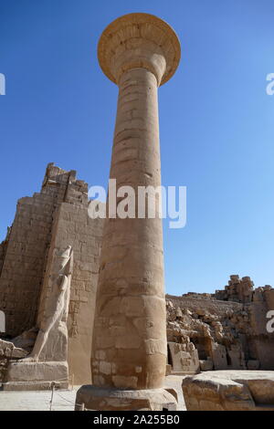 Hypostyle Hall at the Karnak Temple Complex, in Luxor, Egypt. Construction at the complex began during the reign of Senusret I in the Middle Kingdom and continued into the Ptolemaic period, although most of the extant buildings date from the New Kingdom. The area around Karnak was the main place of worship of the eighteenth dynasty Theban Triad with the god Amun as its head. It is part of the monumental city of Thebes. Stock Photo