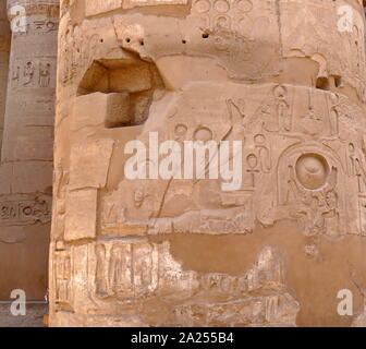 Hypostyle Hall at the Karnak Temple Complex, in Luxor, Egypt. Construction at the complex began during the reign of Senusret I in the Middle Kingdom and continued into the Ptolemaic period, although most of the extant buildings date from the New Kingdom. The area around Karnak was the main place of worship of the eighteenth dynasty Theban Triad with the god Amun as its head. It is part of the monumental city of Thebes. Stock Photo