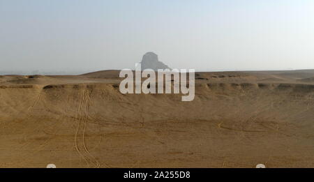 The Pyramid of Amenemhat III, at Dasher, Egypt. The Black Pyramid was built by King Amenemhat III during the Middle Kingdom of Egypt (2055-1650 BC). It is one of the five remaining pyramids of the original eleven pyramids at Dahshur in Egypt. Originally named Amenemhat is Mighty, the pyramid earned the name 'Black Pyramid' for its dark, decaying appearance as a rubble mound. The Black Pyramid was the first to house both the deceased pharaoh and his queens Stock Photo