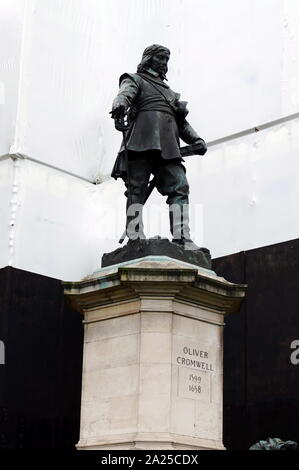 statue of Oliver Cromwell, by Hamo Thornycroft, 1899. Located outside the Palace of Westminster, London. Oliver Cromwell (25 April 1599 – 3 September 1658), was an English military and political leader. He served as Lord Protector of the Commonwealth of England, Scotland, and Ireland from 1653 until his death, acting simultaneously as head of state and head of government of the new republic. Stock Photo
