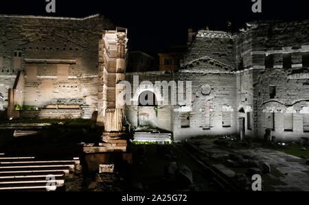 View of the Roman Forum at night. The Roman Forum, also known by its Latin name Forum Romanum, is a rectangular forum surrounded by the ruins of several important ancient government buildings at the centre of the city of Rome. Stock Photo