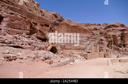 first century AD Nabatean theatre in Petra, Jordan. Substantial part of the theatre was carved out of solid rock, while the scaena and exterior wall were constructed. The theatre's auditorium consists of three horizontal sections of seats separated by passageways and seven stairways to ascend. The theatre could accommodate a number of approximately 8500 people. The theatre was built in the cultural and political apex of the Nabatean kingdom under Aretas IV (9 BC-40 AD), In 1812, the city of Petra and Al-Khazneh was rediscovered by Swiss explorer Johann Ludwig Burckhardt Stock Photo