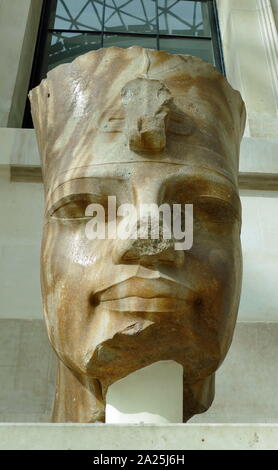 Quartzite colossal head of the Egyptian Pharaoh, Amenhotep III; 18th Dynasty; 1400 BC. The king wears the red crown of Lower Egypt. Found at Thebes Stock Photo