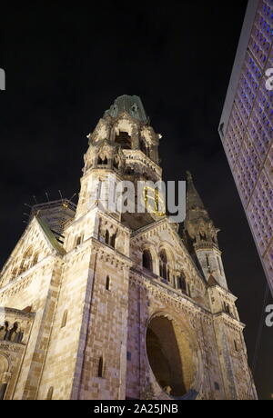 The Kaiser Wilhelm Memorial Church (Gedachtniskirche), Protestant church, located in Berlin on the Kurfurstendamm in the centre of the Breitscheidplatz. The original church on the site was built in the 1890s. It was badly damaged in a bombing raid in 1943. The present building, which consists of a church with an attached foyer and a separate belfry with an attached chapel, was built between 1959 and 1963. Stock Photo