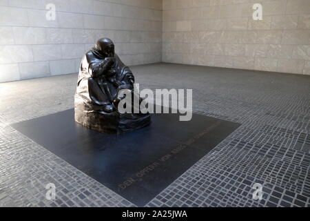 The Neue Wache (New Guardhouse) in Berlin, Germany. It serves as the 'Central Memorial of the Federal Republic of Germany for the Victims of War and Dictatorship'. It is located on the north side of the Unter den Linden boulevard in the central Mitte district. Dating from 1816, the Neue Wache was designed by the architects Karl Friedrich Schinkel and Salomo Sachs. It is a leading example of German Greek Revival architecture. Stock Photo