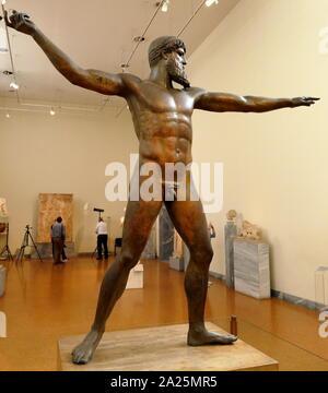 The Artemision Bronze (often called the God from the Sea) is an ancient Greek sculpture that was recovered from the sea off Cape Artemision, in northern Euboea. It represents either Zeus or Poseidon Stock Photo