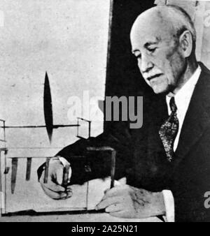 Photograph of Orville Wright with the model of the first wind tunnel. Orville Wright (1871-1948) along with his brother Wilbur, the two were American aviation pioneers. Stock Photo
