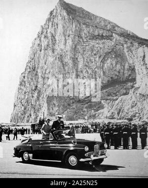 Photograph of Queen Elizabeth driving past the great rock of Gibraltar Stock Photo