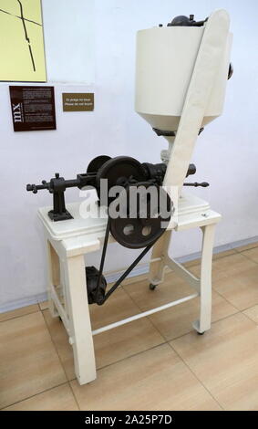 Chocolate dosing machine/ tablet press.