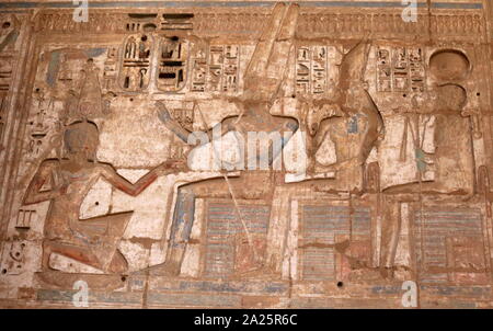 Second Courtyard of the Feasts, Medinet Habu, Thebes, Egypt. Temple of Rameses II at Medinet Habu, Egypt. The Mortuary Temple of Ramesses III at Medinet Habu was an important New Kingdom period temple structure in the West Bank of Luxor in Egypt. The temple has inscribed reliefs depicting the advent and defeat of the Sea Peoples during the reign of Ramesses III. Initial excavation of the temple took place sporadically between 1859 and 1899 Stock Photo