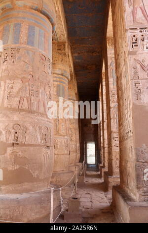 Second Courtyard of the Feasts, Medinet Habu, Thebes, Egypt. Temple of Rameses II at Medinet Habu, Egypt. The Mortuary Temple of Ramesses III at Medinet Habu was an important New Kingdom period temple structure in the West Bank of Luxor in Egypt. The temple has inscribed reliefs depicting the advent and defeat of the Sea Peoples during the reign of Ramesses III. Initial excavation of the temple took place sporadically between 1859 and 1899 Stock Photo