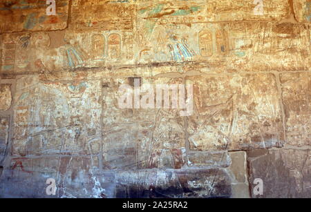 Near the entrance to the Mortuary Temple of Ramesses III, at Medinet Habu, is the Temple of Amun, (Amun Djeser Set) dating to the 18th Dynasty 1458 BC, built by Hatshepsut and Thutmose III. It has undergone many alterations and modifications over the years, partially in the 20th, 25th, 26th, 29th and 30th Dynasties and the Greco-Roman period. Stock Photo