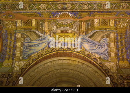 Mosaic in the Kaiser Wilhelm Memorial Church (Gedachtniskirche) in Berlin. The original church on the site was built in the 1890s. It was badly damaged in a bombing raid in 1943. The present building, which consists of a church with an attached foyer and a separate belfry with an attached chapel, was built between 1959 and 1963. The damaged spire of the old church has been retained and its ground floor has been made into a memorial hall. Stock Photo