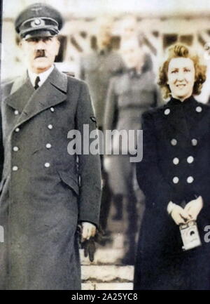 Colour photograph of Eva Braun with Adolf Hitler. Eva Anna Paula Hitler (1912-1945) long-time companion and wife of Adolf Hitler. Adolf Hitler (1889-1945) a German politician and leader of the Nazi Party. Stock Photo