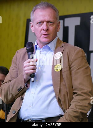 Phillip James Lee, British, Conservative politician, Member of Parliament (MP) for Bracknell, addresses the 'People's Vote' march in Parliament Square, London. The People's Vote march took place in London on 23 March 2019 as part of a series of demonstrations to protest against Brexit, call for a new referendum, and ask the British Government to revoke Article 50. It brought to the capital hundreds of thousands of protestors, or over a million people according to the organizers. Stock Photo