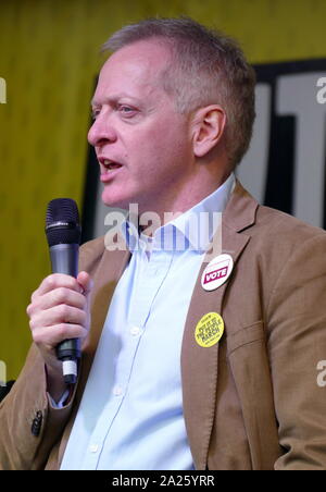 Phillip James Lee, British, Conservative politician, Member of Parliament (MP) for Bracknell, addresses the 'People's Vote' march in Parliament Square, London. The People's Vote march took place in London on 23 March 2019 as part of a series of demonstrations to protest against Brexit, call for a new referendum, and ask the British Government to revoke Article 50. It brought to the capital hundreds of thousands of protestors, or over a million people according to the organizers. Stock Photo