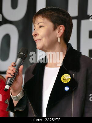 Caroline Lucas; British; Green Party; politician; Member of Parliament (MP) for Brighton Pavilion, addresses the 'People's Vote' march in Parliament Square, London. The People's Vote march took place in London on 23 March 2019 as part of a series of demonstrations to protest against Brexit, call for a new referendum, and ask the British Government to revoke Article 50. It brought to the capital hundreds of thousands of protestors, or over a million people according to the organizers. Stock Photo