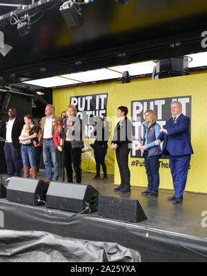 Pro-Referendum MP's from different parties at the 'People's Vote' march in Parliament Square, London. The People's Vote march took place in London on 23 March 2019 as part of a series of demonstrations to protest against Brexit, call for a new referendum, and ask the British Government to revoke Article 50. It brought to the capital hundreds of thousands of protestors, or over a million people according to the organizers. Left to right: David Lammy, Jo Swinson, Phillip Lee, Rosena Allin-Khan, Caroline Lucas, Justine Greening, Ian Blackford, Anna Soubry. Stock Photo