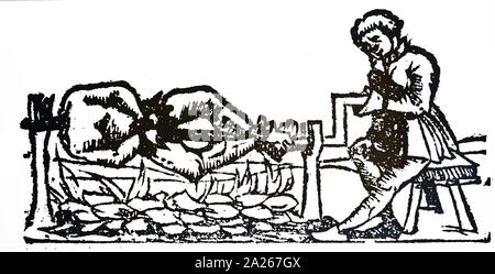 A woodcut engraving depicting the practice of Cannibalism: a man is cooking a human body on a spit. Dated 16th century Stock Photo