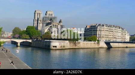 Scene showing the impact of the fire which damaged Notre Dame Cathedral the morning after the fire was extinguished. The destruction of the roof can be seen Stock Photo