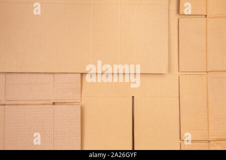 Old used corrugated striped cardboard boxes parts background Stock Photo