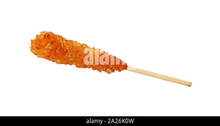 Close up one wooden stick with brown sugar crystals isolated on white background, elevated top view, directly above Stock Photo