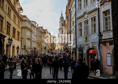 Prague, people tourists walking fpr shopping in old famous city street with architecture on cloudy blue sky,czech repubblic Stock Photo