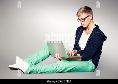 Focused student working on laptop. Stock Photo