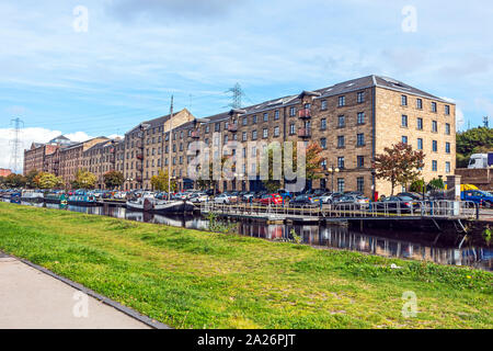 Old warehouses converted to flats at Speirs Wharf at the Glasgow branch of the Forth and Clyde Canal in Glasgow Scotland UK Stock Photo