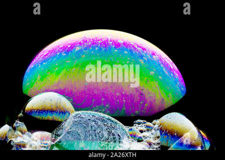 Colorful planets - beautiful  soap-bubble abstract on black background Stock Photo
