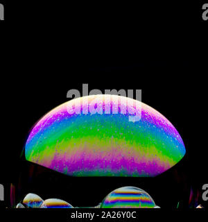 Colorful planets - beautiful  soap-bubble abstract on black background Stock Photo