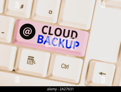 Word writing text Cloud Backup. Business photo showcasing enable customers to remotely access the provider s is services White pc keyboard with empty Stock Photo