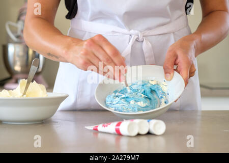 making and decorating a cake Stock Photo